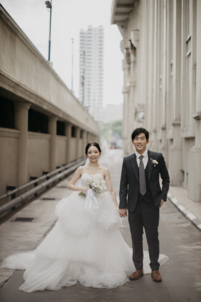 Joseph & Dewi Hold Hand Front
